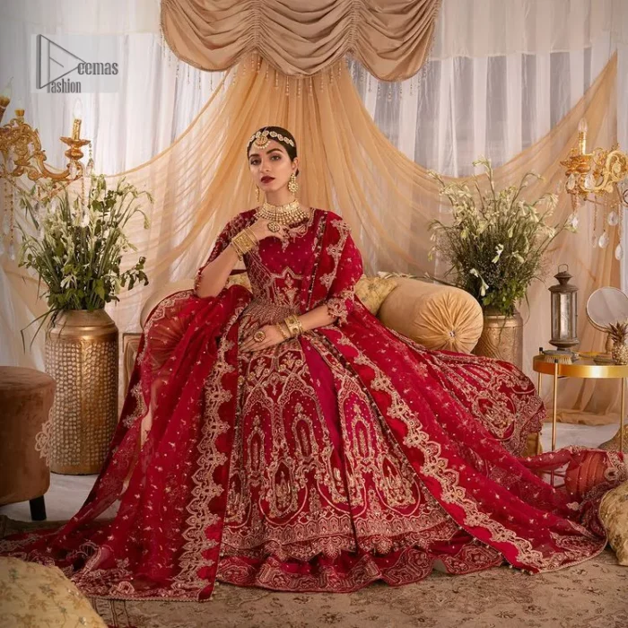Enter the world of allurement with red shade, a gorgeous go-to dress for your big day to make you look classy and fabulous at the same time! A red organza base reception outfit is generously light golden embroidered with tilla, dabka, kora, Kundan and resham to form a beautifully composed lehenga, maxi and dupatta. The round neckline, three quarter sleeves make this outfit super amazing and charming. It is paired up with lehenga which is adorned with ting floral motifs. The can-can make this lehenga a dreamy real magic. Finish this look with dupatta, framed with a four sided borders. It is enhanced with sparkling of tiny floral motifs and sequins spray.