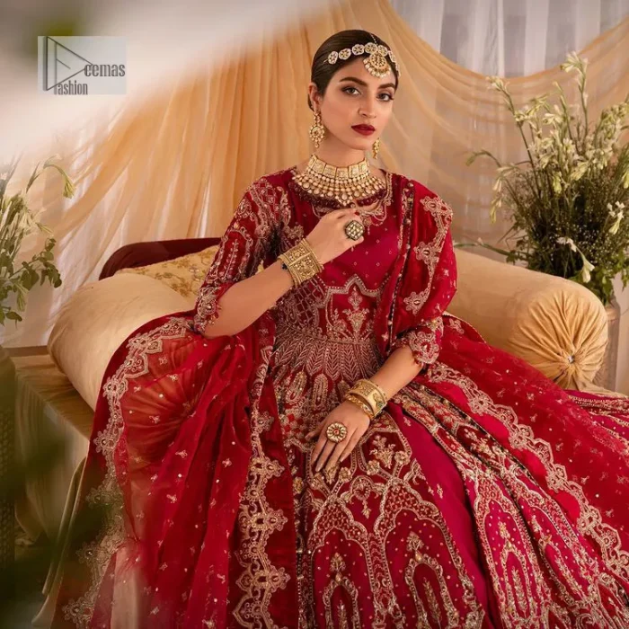 Enter the world of allurement with red shade, a gorgeous go-to dress for your big day to make you look classy and fabulous at the same time! A red organza base reception outfit is generously light golden embroidered with tilla, dabka, kora, Kundan and resham to form a beautifully composed lehenga, maxi and dupatta. The round neckline, three quarter sleeves make this outfit super amazing and charming. It is paired up with lehenga which is adorned with ting floral motifs. The can-can make this lehenga a dreamy real magic. Finish this look with dupatta, framed with a four sided borders. It is enhanced with sparkling of tiny floral motifs and sequins spray.