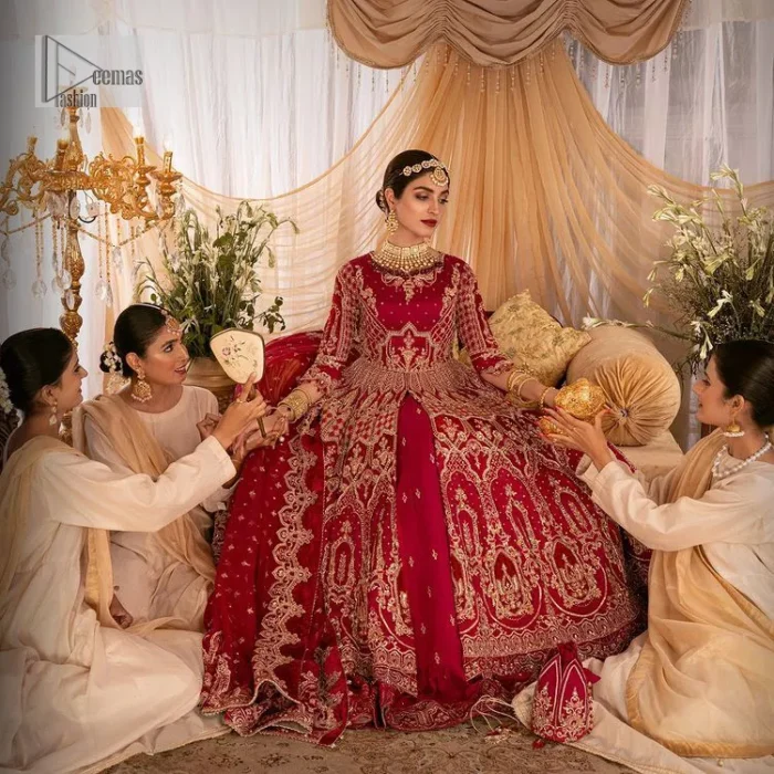 Enter the world of allurement with red shade, a gorgeous go-to dress for your big day to make you look classy and fabulous at the same time! A red organza base reception outfit is generously light golden embroidered with tilla, dabka, kora, Kundan and resham to form a beautifully composed lehenga, maxi and dupatta. The round neckline, three quarter sleeves make this outfit super amazing and charming. It is paired up with lehenga which is adorned with ting floral motifs. The can-can make this lehenga a dreamy real magic. Finish this look with dupatta, framed with a four sided borders. It is enhanced with sparkling of tiny floral motifs and sequins spray.