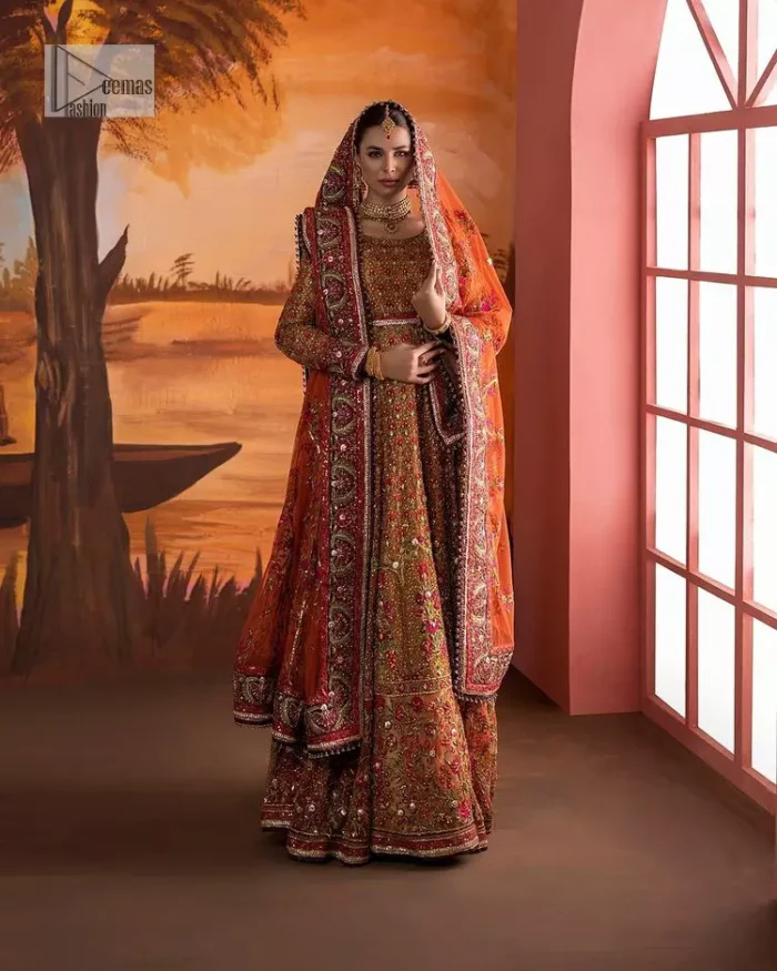 Blissful rust! This ensemble is the epitome of grace. DeemasFashion presents this beautiful mehndi outfit in rust colour to make your day super amazing. The flare maxi is attractively adorned with thread, kora, Kundan and the real magic of Zardozi. It is decorated with multiple colour embroidery to give you glam and gorgeous look. The round neckline and full sleeves are a finished way to make this masterpiece more attractive and charming. The following maxi is paired up with a dupatta in the same colour framed with a four-sided border to make the outfit graceful.