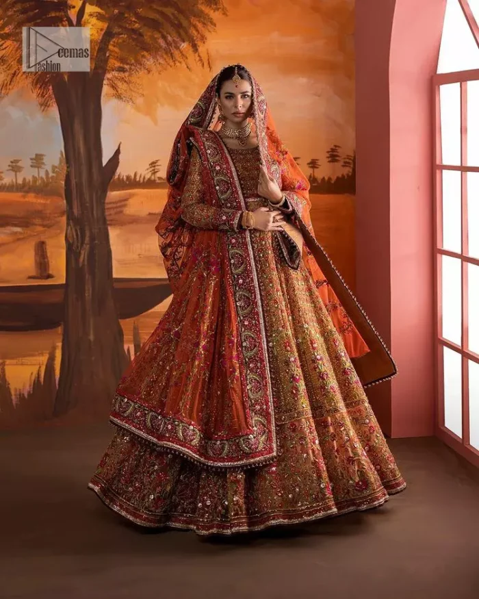 Blissful rust! This ensemble is the epitome of grace. DeemasFashion presents this beautiful mehndi outfit in rust colour to make your day super amazing. The flare maxi is attractively adorned with thread, kora, Kundan and the real magic of Zardozi. It is decorated with multiple colour embroidery to give you glam and gorgeous look. The round neckline and full sleeves are a finished way to make this masterpiece more attractive and charming. The following maxi is paired up with a dupatta in the same colour framed with a four-sided border to make the outfit graceful.
