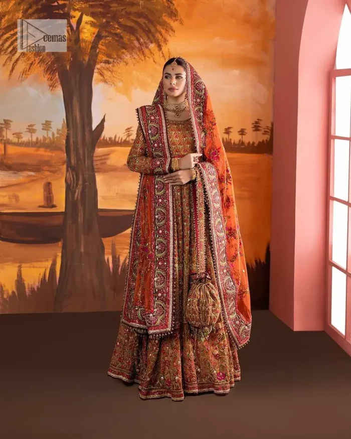 Blissful rust! This ensemble is the epitome of grace. DeemasFashion presents this beautiful mehndi outfit in rust colour to make your day super amazing. The flare maxi is attractively adorned with thread, kora, Kundan and the real magic of Zardozi. It is decorated with multiple colour embroidery to give you glam and gorgeous look. The round neckline and full sleeves are a finished way to make this masterpiece more attractive and charming. The following maxi is paired up with a dupatta in the same colour framed with a four-sided border to make the outfit graceful.