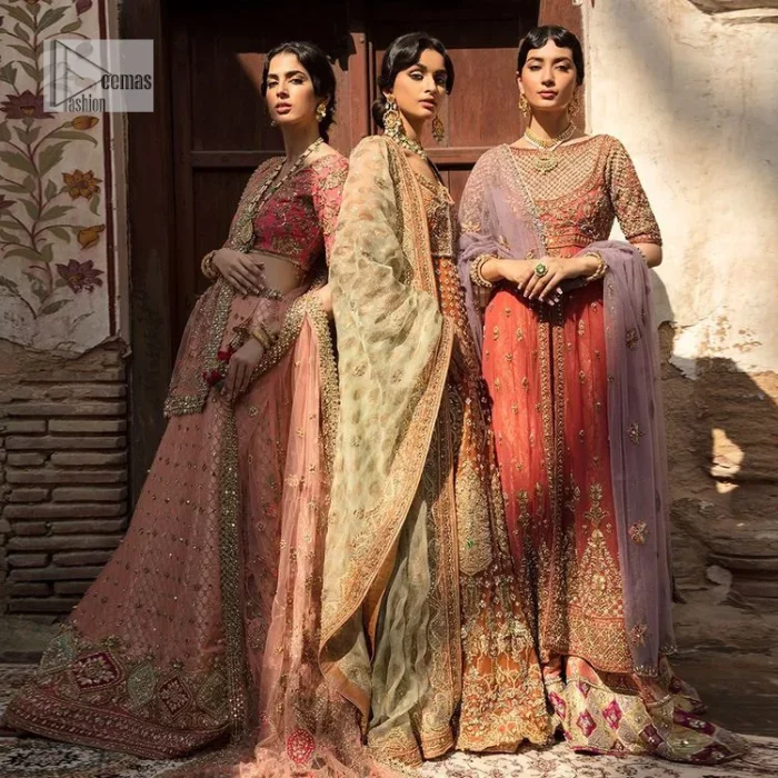 Let your dreams be your wings as your mehndi outfit. This rust heavy maxi features thoughtfully placed bold motifs all over and each motif is crafted using tilla, dabka, koran, Resham and Zardozi techniques. It is further enhanced with golden embroidery. The V shape neckline adds more beauty to the outfit when comes with embellished full sleeves. The beautiful outfit achieves the final ravishing look when paired with a delicate dupatta. The borders of this dupatta are heavily adorned with embroidery that gives a slaying touch to the whole attire.