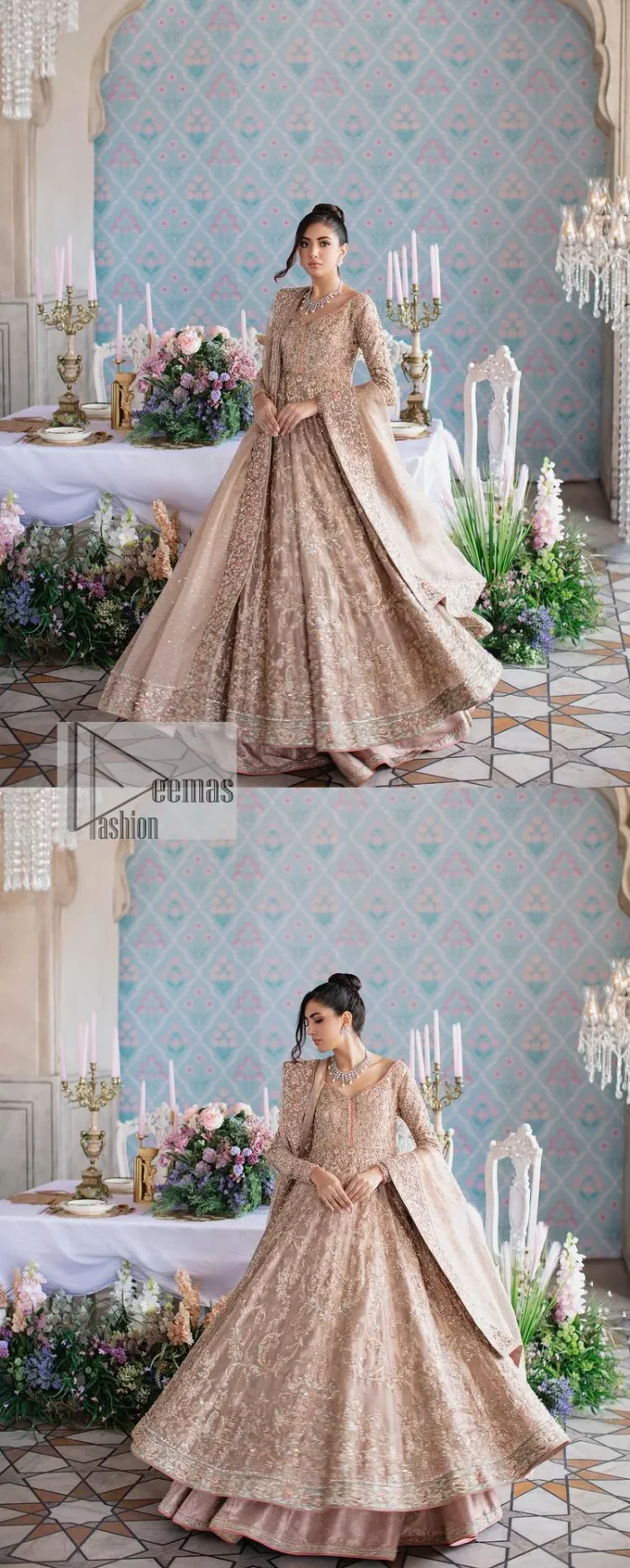 Make your Qabool Hai moment more memorable with this outfit by DeemasFashion. A dreamy statement of this dress proffers a soft pink hue with glamorous silver and golden embroidery.  It is further enhanced with tilla, dabka, kora, Kundan and the real magic of zardozi. V neckline enhances the overall glamour of this masterpiece. Intricate designs and fine details on the sleeves give a perfect finishing look to this maxi. The maxi is layered over a meticulously handcrafted lehnga which is bold enough to stand out in the crowd. Finish this article with a dupatta which is ornamented with four-sided borders and sequins sprayed all over which is a unique piece for your Nikah look. 