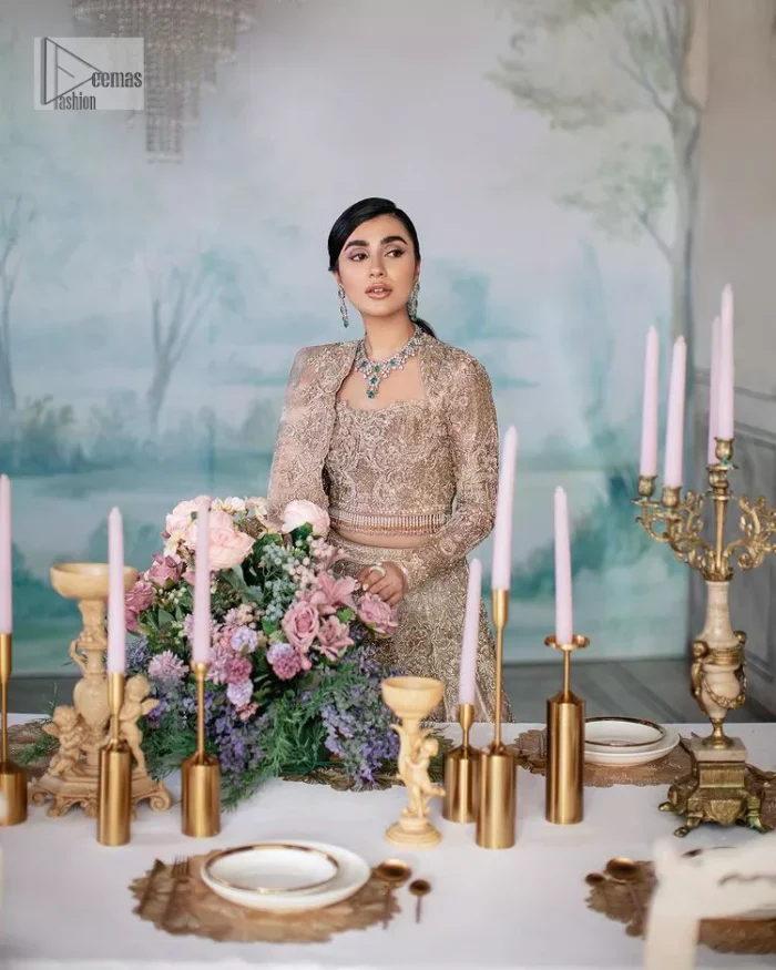 Trendy embroidery on a classic base – A perfect combination for your Nikah! DeemasFashion presents the tea rose article which is laboriously embellished with light golden embroidery which is further enhanced with tilla, dabka, kora, Kundan and beautiful details of Zardozi. The neckline is decorated with handsome embroidery. Further, the full sleeves of the blouse are unique in style and have a classy look and perfect choice for a bride. It is paired with flared lehenga which is heavily ornamented with embroidery to make your day memorable. Complete this article with a dupatta, framed with four-sided borders and sequins spray all over which is giving a charming finishing look to the dress.