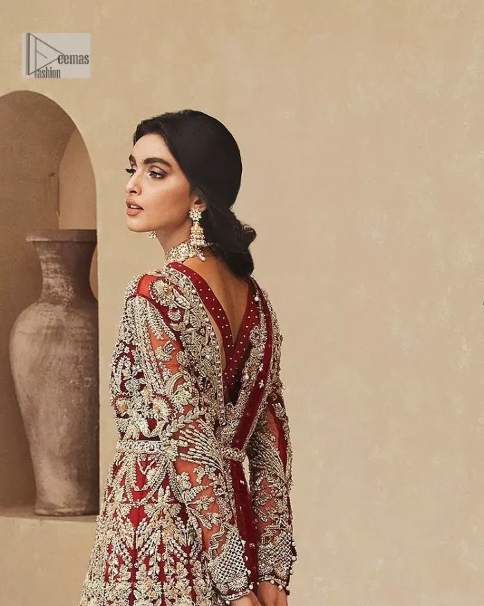 Classic and eye-catching! Made for stylish brides.  This reception wear in the bright red shade comes in a stunning open style and is hand-embellished with tilla,dabka, kora, Kundan and Zardozi details. The golden embroidery gives a royal touch to the dress. The V shape neckline gives you a dreamy appearance on the most important day of your life. Intricate designs and hand-crafted embellishments on full sleeves also make a look. It is systemized with a lehenga which has a huge flare and is adorned with embroidery. Complete this article with a dupatta framed with four-sided borders that is a perfect choice.