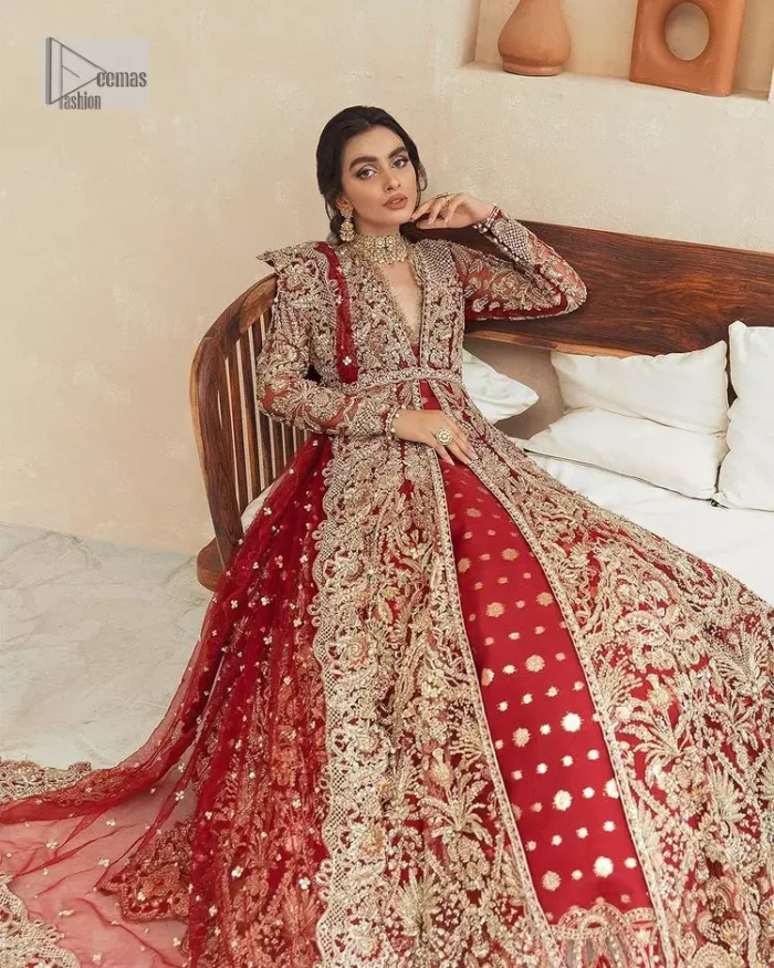 Classic and eye-catching! Made for stylish brides.  This reception wear in the bright red shade comes in a stunning open style and is hand-embellished with tilla,dabka, kora, Kundan and Zardozi details. The golden embroidery gives a royal touch to the dress. The V shape neckline gives you a dreamy appearance on the most important day of your life. Intricate designs and hand-crafted embellishments on full sleeves also make a look. It is systemized with a lehenga which has a huge flare and is adorned with embroidery. Complete this article with a dupatta framed with four-sided borders that is a perfect choice.