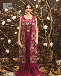 Sumptuously burgundy! This alluring outfit is surely any girl’s dream. DeemasFashion presents the three-piece outfit to make your event super bright. The blouse is handsomely laden with multiple colour embroidery. Beaming ornaments, zardozi, tilla,dabka, kora and Kundan make this blouse an epitome of grace. The boat shape neckline of the blouse a glamorous touch to this beautiful masterpiece. Paired up with a front open gown, hand-crafted beaming embellishments and luxury designs give a unique artistic look. The sleeveless style of the gown gives a royal appearance. Complete this article with a crushed skirt making it a perfect choice to pair with the blouse and gown.