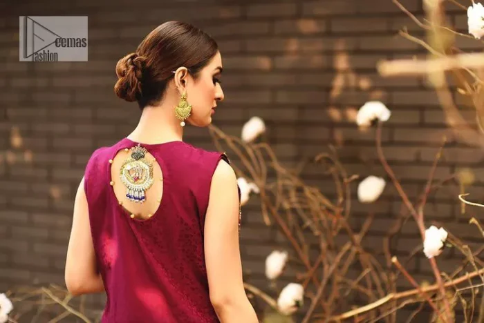 Sumptuously burgundy! This alluring outfit is surely any girl’s dream. DeemasFashion presents the three-piece outfit to make your event super bright. The blouse is handsomely laden with multiple colour embroidery. Beaming ornaments, zardozi, tilla,dabka, kora and Kundan make this blouse an epitome of grace. The boat shape neckline of the blouse a glamorous touch to this beautiful masterpiece. Paired up with a front open gown, hand-crafted beaming embellishments and luxury designs give a unique artistic look. The sleeveless style of the gown gives a royal appearance. Complete this article with a crushed skirt making it a perfect choice to pair with the blouse and gown.