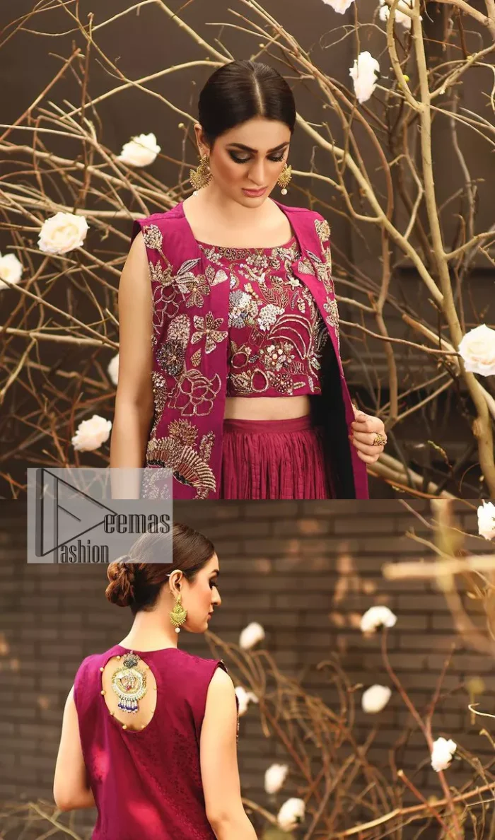 Sumptuously burgundy! This alluring outfit is surely any girl’s dream. DeemasFashion presents the three-piece outfit to make your event super bright. The blouse is handsomely laden with multiple colour embroidery. Beaming ornaments, zardozi, tilla,dabka, kora and Kundan make this blouse an epitome of grace. The boat shape neckline of the blouse a glamorous touch to this beautiful masterpiece. Paired up with a front open gown, hand-crafted beaming embellishments and luxury designs give a unique artistic look. The sleeveless style of the gown gives a royal appearance. Complete this article with a crushed skirt making it a perfect choice to pair with the blouse and gown.