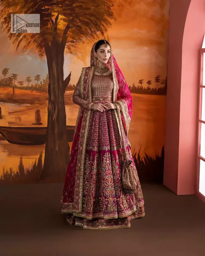 Experience the true essence of reception wear in alluring attires from DeemasFashion. The host pink pishwas is decorated with multiple colour embroidery which is handsomely enhanced with tilla, dabka, kora, Kundan and the real magic of Zardozi to make this masterpiece unique and charming. The finishing of boat shape neckline enhances the beauty of the attire. Furthermore, the full sleeves of the pishwas are a perfectly charming choice to pair with a Pishwas. It is coordinated with a jamawar lehenga whose border is adorned with beautiful embroidery. Complete this article with a dupatta framed with four-sided embellished borders and sequins sprayed all over.