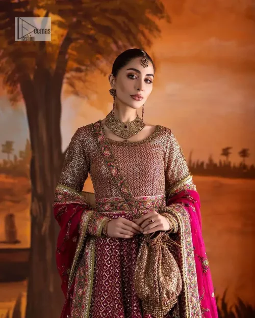 Experience the true essence of reception wear in alluring attires from DeemasFashion. The host pink pishwas is decorated with multiple