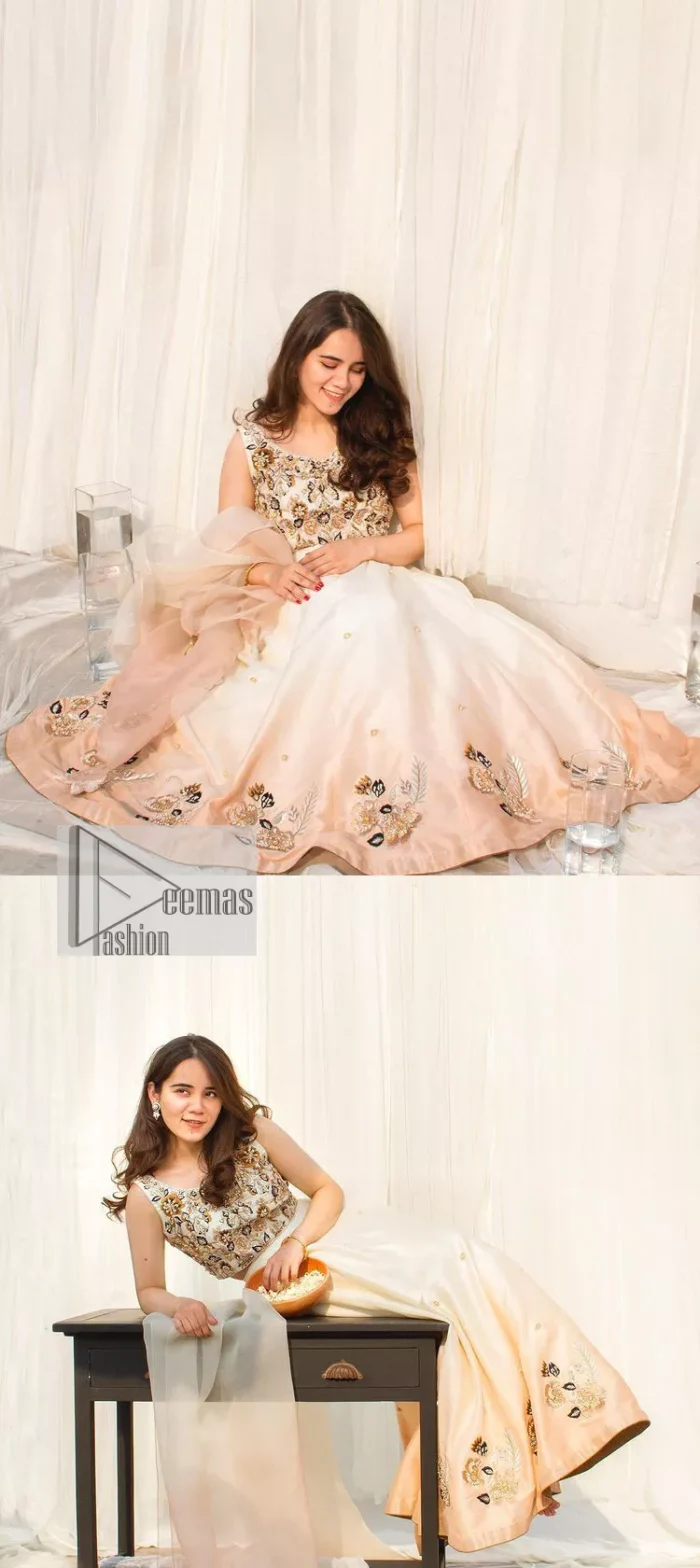 The fusion of this softest canvas decorated with vibrant contrasts is all you need to stun at any party! The embellished ivory article is the season’s most irresistible trend, the new-age lehenga blouse. The impeccably tailored choli has delicate multiple colour embroidery which intensifies with tilla, dabka, kora, Kundan and magic of Zardozi. The round neckline of the blouse is a beautifully crafted ensemble when combined with sleeveless style. The following blouse is paired with a double-tone can-can lehenga which is ornamented with embroidery on the border making it a perfect choice to pair with this masterpiece.