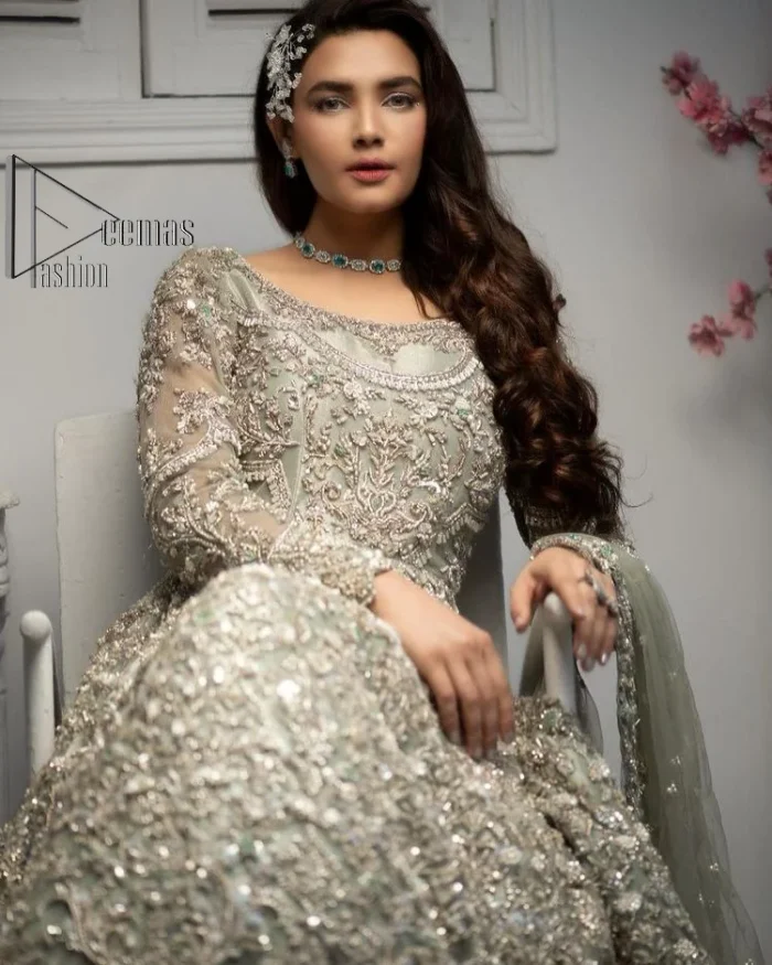 It was love at first swipe! Present this olive green back train maxi which is laboriously hand-rendered with silver embroidery to make you a pure soulful bride. It is enhanced with tilla, dabka, kora and Kundan. The illusion neckline adds more beauty to this walima wear when comes with full sleeves. The back train flare is made just for you to catch more and more love from your loved ones. Complete this walima wear with a dupatta in the same colour which is handsomely embellished with a four-sided heavy border and sequins sprayed all over to receive more love.