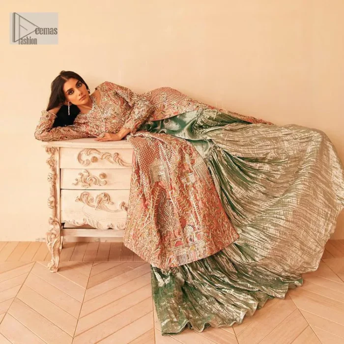 The latest elegant embroidered maxi in peach colour with magnificence embroidered work. The front open maxi is attractively laden with light golden embroidery to make this masterpiece unique and charming. Purely balanced raw silk maxi is presented with an ethereal blend of Resham, naqshi, kora, dabka and Mukesh carved with stones. Full Sleeves of the following maxi are also heavily embroidered. The round neckline gives it a magical look. It is coordinated with crushed lehenga in a pistachio green colour to create a ravishing Nikkah bride look. This crushed lehenga is paired with embroidered dupatta detailed with a splash of sequins and embroidered borders.