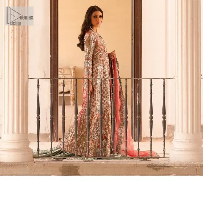 The latest elegant embroidered maxi in peach colour with magnificence embroidered work. The front open maxi is attractively laden with light golden embroidery to make this masterpiece unique and charming. Purely balanced raw silk maxi is presented with an ethereal blend of Resham, naqshi, kora, dabka and Mukesh carved with stones. Full Sleeves of the following maxi are also heavily embroidered. The round neckline gives it a magical look. It is coordinated with crushed lehenga in a pistachio green colour to create a ravishing Nikkah bride look. This crushed lehenga is paired with embroidered dupatta detailed with a splash of sequins and embroidered borders.