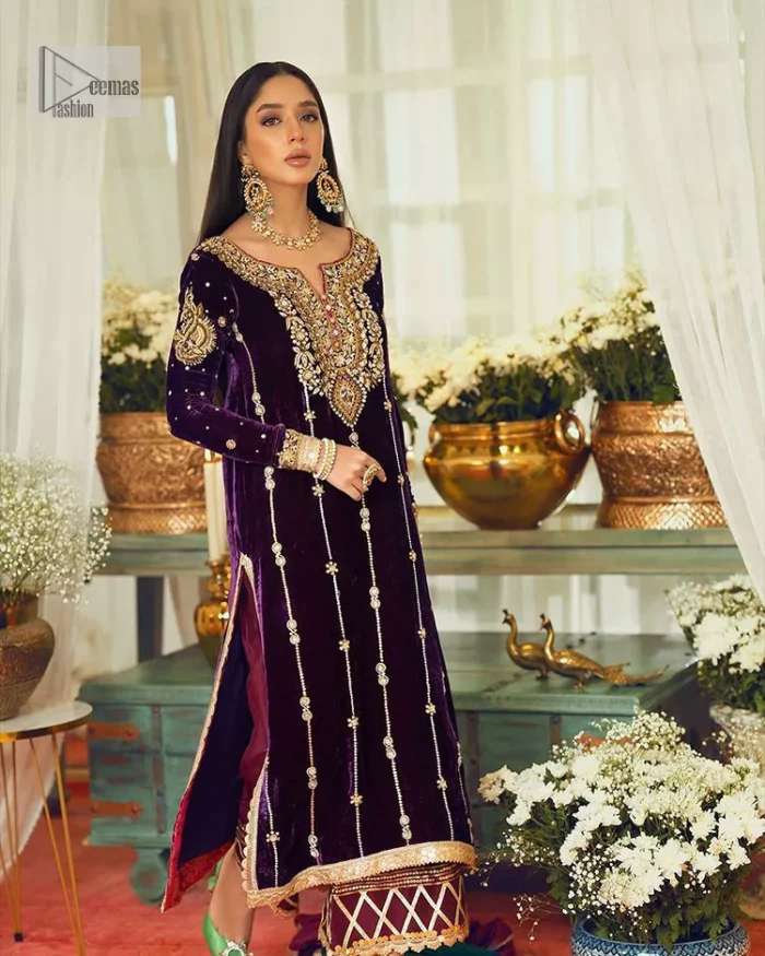 Dress yourself up in glamorous ensembles. DeemasFaashion presents this beautiful party outfit in plum colour. It is highlighted with golden embroidery which is further enhanced with tilla, dabka, kora, Kundan and the real magic of zardozi. The full sleeves are embellished with sequins spray and floral motifs. In addition to this, the embroidered neckline makes this outfit more pretty. It is paired with maroon trousers with beautiful and stunning borders to balance the article. Complete this article with a dupatta in green and plum colour to fulfil the aesthetic look. 