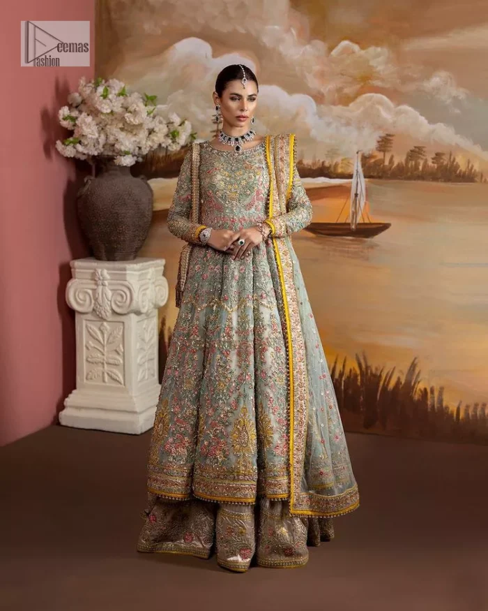 Enhance your beauty by dressing in magic. The most beautiful day of your life deserves an overall dome of embodiment, which is why you need an aqua-blue Anarkali to make you look stunning as a bride. The aqua blue, Anarkali and lehenga are hand-rendered in multiple colour embroidery and are further enhanced with pearls, nakshi, Sitara, tilla, kora, Zardozi and dabka.  The round neckline of the following Anarkali defines the beauty and charm of this unique article. Furthermore, the full sleeves are adorned with floral patterns. It is paired up with lehenga which is ornamented with a heavily embellished border to make this masterpiece unique. Complete this nikah wear with a dupatta adorned with four-sided embellished borders and tiny motifs sprinkled all over.