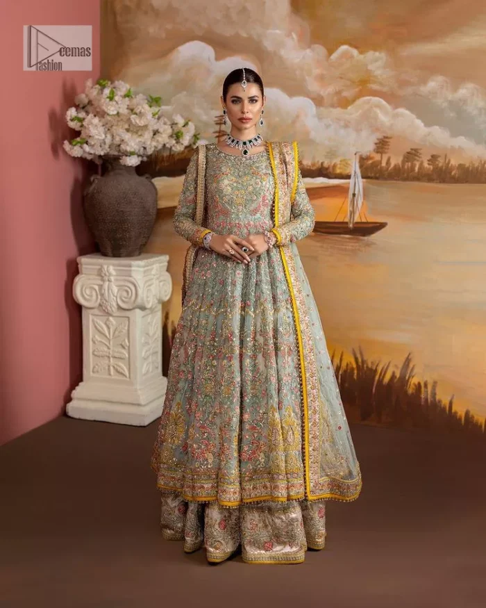 Enhance your beauty by dressing in magic. The most beautiful day of your life deserves an overall dome of embodiment, which is why you need an aqua-blue Anarkali to make you look stunning as a bride. The aqua blue, Anarkali and lehenga are hand-rendered in multiple colour embroidery and are further enhanced with pearls, nakshi, Sitara, tilla, kora, Zardozi and dabka.  The round neckline of the following Anarkali defines the beauty and charm of this unique article. Furthermore, the full sleeves are adorned with floral patterns. It is paired up with lehenga which is ornamented with a heavily embellished border to make this masterpiece unique. Complete this nikah wear with a dupatta adorned with four-sided embellished borders and tiny motifs sprinkled all over.