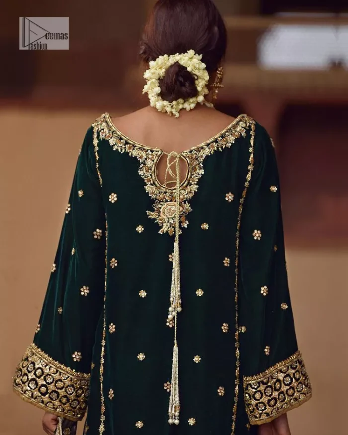 This outfit glam up in our detailed embroidered fabrics made to make you shine for every occasion. The black long shirt in premium quality velvet is beautifully decorated with multiple colour embroidery which is further enhanced with tilla, dabka, kora, Kundan and the real magic of Zardozi. The following shirt has an embellished neckline to meet the trending grace. Further, the half sleeves are adorned with floral motifs. It is coordinated with sharara in the same colour to balance the overall royal look of this party wear. Complete this article with a dupatta in the double shade that is a beautiful piece for a bridesmaid who has a unique taste.