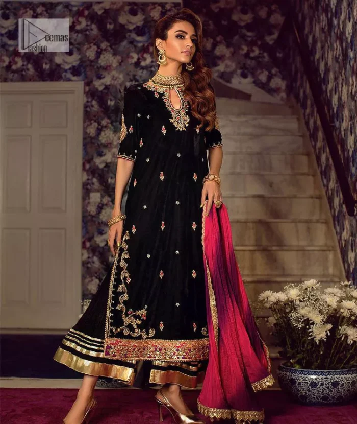 This outfit glam up in our detailed embroidered fabrics made to make you shine for every occasion. The black long shirt in premium quality velvet is beautifully decorated with multiple colour embroidery which is further enhanced with tilla, dabka, kora, Kundan and the real magic of Zardozi. The following shirt has an embellished neckline to meet the trending grace. Further, the half sleeves are adorned with floral motifs. It is coordinated with sharara in the same colour to balance the overall royal look of this party wear. Complete this article with a dupatta in the double shade that is a beautiful piece for a bridesmaid who has a unique taste.