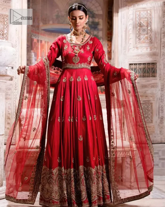 The traditional style is the new thing in the market. The stunning pishwas in the deep red shade is an eye-catching attire that gives you your desired dreamy appearance on your Big day. Beautiful work of zardozi, tilla, dabka, kora, Kundan, pearls, and beads make this attire an epitome of glamour and royalty. Embellished borders, as well as the bodice, gives an enchanting touch to this pishwas. Further, the round neckline of the outfit gives a royal touch. Further, fancy floral motifs are also adorned on the sleeves of this reception wear. It is organized with a dupatta framed with a four-sided border and sparkling tiny floral motifs all over.