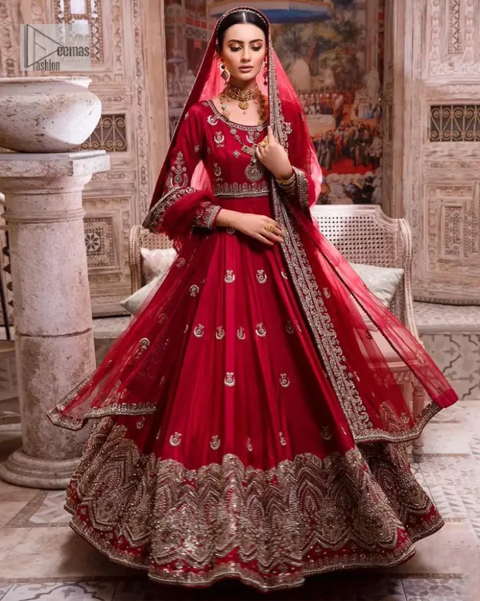 The traditional style is the new thing in the market. The stunning pishwas in the deep red shade is an eye-catching attire that gives you your desired dreamy appearance on your Big day. Beautiful work of zardozi, tilla, dabka, kora, Kundan, pearls, and beads make this attire an epitome of glamour and royalty. Embellished borders, as well as the bodice, gives an enchanting touch to this pishwas. Further, the round neckline of the outfit gives a royal touch. Further, fancy floral motifs are also adorned on the sleeves of this reception wear. It is organized with a dupatta framed with a four-sided border and sparkling tiny floral motifs all over.