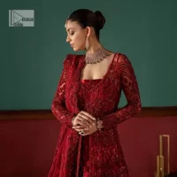 Deep red is just associated with love and romance! For a more lovely and romantic look on your big day just buy this reception wear. The deep red maxi is heavily adorned with intricate hand-worked of tilla, dabka, kora, Kundan and Zardozi in the shade of red which is sure to make you look glamorous on your big day. The square neckline merges rich traditions with modern style. Further, the full sleeves of the maxi also add more charms. It is organized with a back train lehenga which is also embellished and highlighted with floral motifs. Complete this super romantic look with a dupatta which is encrusted with four-sided embellished borders and floral motifs sprinkled all over. 