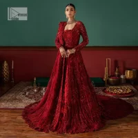 Deep red is just associated with love and romance! For a more lovely and romantic look on your big day just buy this reception wear. The deep red maxi is heavily adorned with intricate hand-worked of tilla, dabka, kora, Kundan and Zardozi in the shade of red which is sure to make you look glamorous on your big day. The square neckline merges rich traditions with modern style. Further, the full sleeves of the maxi also add more charms. It is organized with a back train lehenga which is also embellished and highlighted with floral motifs. Complete this super romantic look with a dupatta which is encrusted with four-sided embellished borders and floral motifs sprinkled all over. 