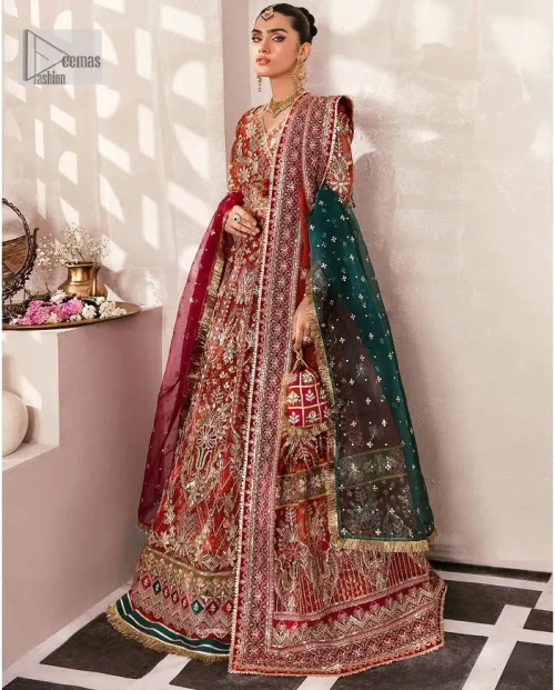 This deep rust outfit with a floral pattern has you covered for your big day. This deep rust angrakha is