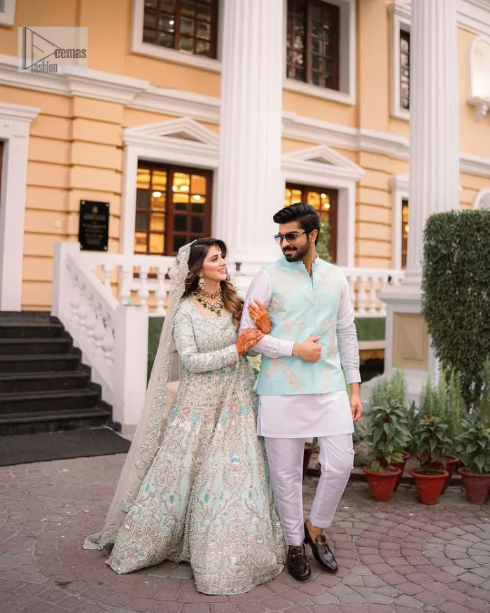 Brighten up your big day with this beautiful ensemble - Perfectly suited to the trend! DeemasFashion presents this nikah wear in the shade of ice blue. This stunning maxi has a fully embellished square neckline and full sleeves. Graceful multiple-colour work and floral designs enhance the charm of this maxi. Zardozi, pearls, dabka, kora, Kundan, and stones give a perfect finish to the overall look. The flares of the following maxi make it your foremost priority to wear on the most important day of your life. Paired this with a dupatta which is adorned with a four sided embellished borders and sequins sprayed all over to make this look more charming and perfect.