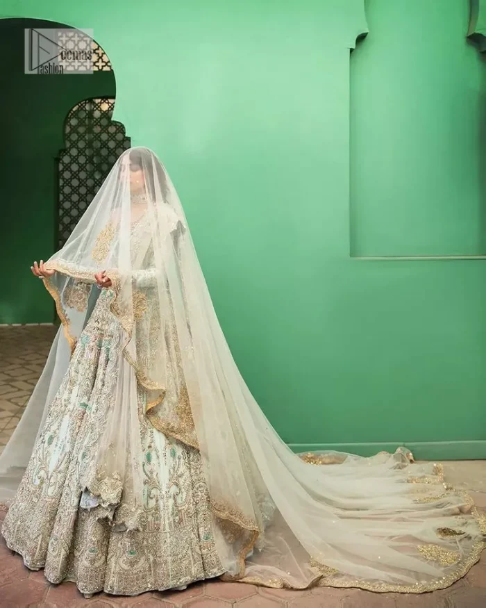 Brighten up your big day with this beautiful ensemble - Perfectly suited to the trend! DeemasFashion presents this nikah wear in the shade of ice blue. This stunning maxi has a fully embellished square neckline and full sleeves. Graceful multiple-colour work and floral designs enhance the charm of this maxi. Zardozi, pearls, dabka, kora, Kundan, and stones give a perfect finish to the overall look. The flares of the following maxi make it your foremost priority to wear on the most important day of your life. Paired this with a dupatta which is adorned with a four sided embellished borders and sequins sprayed all over to make this look more charming and perfect.