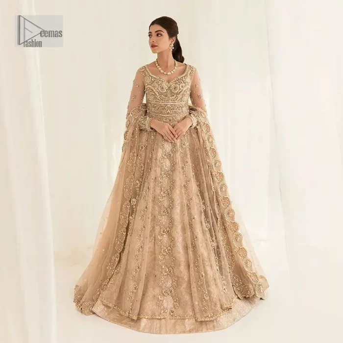Presenting elegance personified glamorous formal nikah outfit. A heavenly-designed light golden maxi on an organza base serves as a canvas for spellbinding embellishments of antique gold, tilla, dabka, kora, Kundan and sequins. The sweetheart neckline makes this outfit unique and priceless. Furthermore, the following flawed maxi has three-quarter sleeves. It is paired with a plain lehenga and a dupatta in the same colour. The dupatta is adorned with carefully placed sequin spray and embellished four-sided borders for more calm and charm.