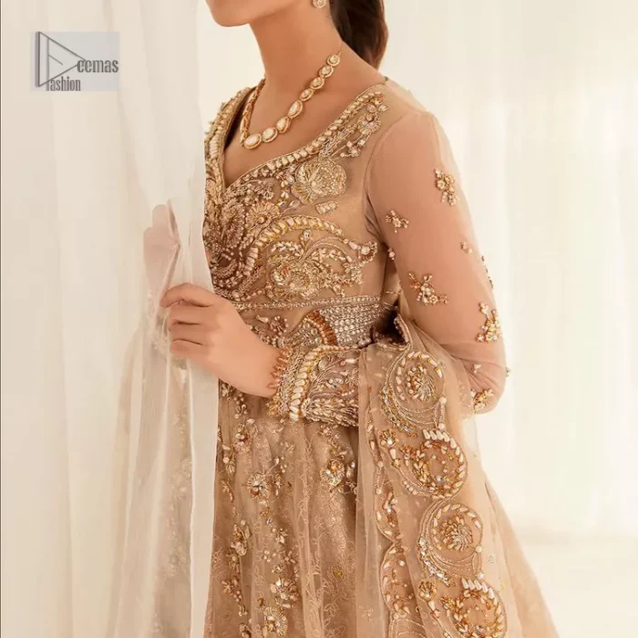 Presenting elegance personified glamorous formal nikah outfit. A heavenly-designed light golden maxi on an organza base serves as a canvas for spellbinding embellishments of antique gold, tilla, dabka, kora, Kundan and sequins. The sweetheart neckline makes this outfit unique and priceless. Furthermore, the following flawed maxi has three-quarter sleeves. It is paired with a plain lehenga and a dupatta in the same colour. The dupatta is adorned with carefully placed sequin spray and embellished four-sided borders for more calm and charm.