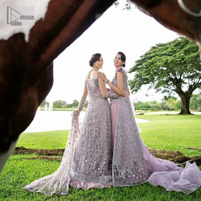 Lilac article on your Big day is like a pro. This lilac front open gown in the lilac shade is the epitome of royalty and grace. The gorgeous gown is adorned with silver dabka, pearls,tilla, kora, Kundan, zardozi and the real magic of beads. It is prominent with silver embroidery. The following gown has a V shape neckline to make this outfit remarkable. Further, the beautiful embroidery is adorned on full sleeves. The fully embellished lilac Gown will look perfect when paired with a set of plain lehenga choli. It is organized with a dupatta framed with four-sided borders and tiny floral motifs all over to gain pro magic.