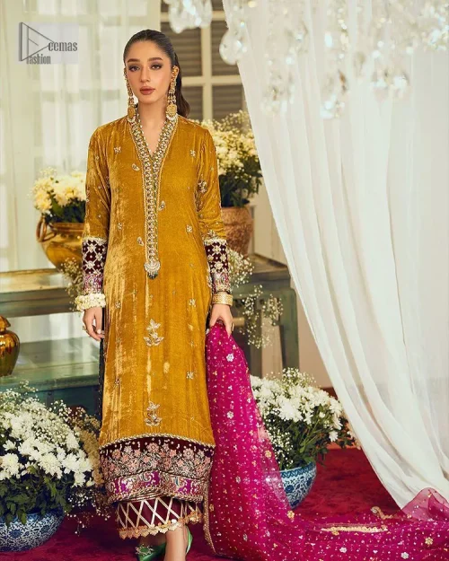 This mustard ensemble features zari and tilla details creating the perfect magical look for the season! The stunning long shirt