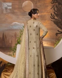 It's where words are not necessary – the outfit does all the talking! A beautiful designed pale green long shirt on an organza base has intricate details of gold, sequin, tilla, dabka, kora and tilla. A contrasting golden embroidery on the round neckline and on full sleeves is the star of the show. Each floral motif is so special, well-researched and strategically put together to create this spellbinding magic using the most gorgeous colour palette. It is paired with brocade lehenga to balance the whole outfit in a golden colour. Last but not least, the mehndi wear has a dupatta which is adorned with a four-sided embellished border in the most stunning way.