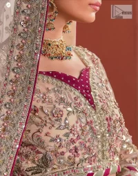 This elegantly poised nikah wear defines trendy fashion in its most acceptable form! The lehenga blouse is in the peach shade and hand-embellished with pearls, tilla, Resham, and dabka. Lavish designs on full sleeves and fine details on the sweetheart neckline make this breathtaking blouse your foremost priority for the wedding day. The blouse is enhanced with multiple colour embroidery to make your day more aesthetic. It is paired up with can-can lehenga that is adorned with heavy embroidery for perfection. A delicate dupatta is paired with this alluring Lehenga Choli that gives a magnificent look to the gorgeous bride that is adorned with four-sided borders and tiny floral motifs all over.