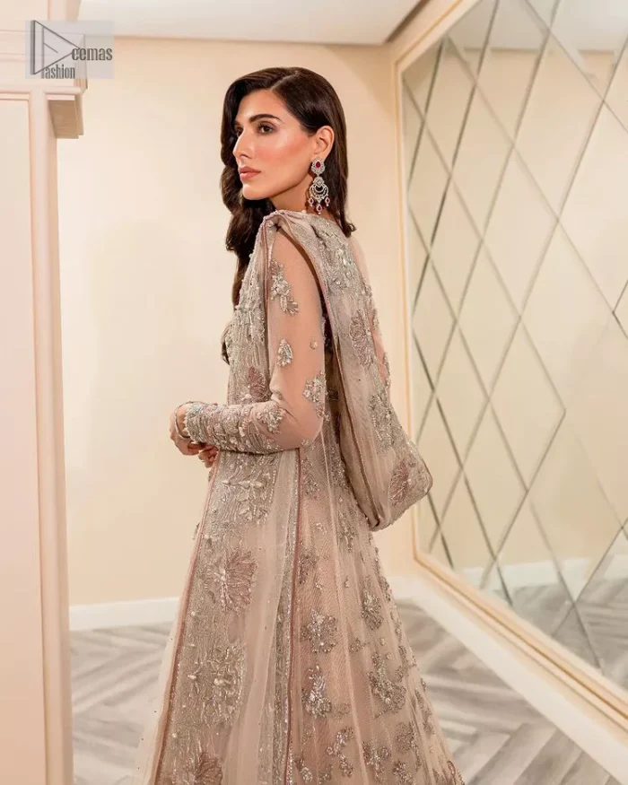 Get ready to lost in the world with floral and trendy designs. This dress is beautifully decorated with heavy embroidery. It is highlighted with kora, dabka, tilla, sequins and pearls. The shirt is enhanced with zardozi work on a jewel neckline. It comes with a plain lehenga in the same colour to balance the beautiful outfit. It is coordinated with a tissue dupatta which is sprinkled with sequins all over it. It is further furnished with a four-sided embellished border giving a perfectly glamorous look to the whole nikah wear. 
