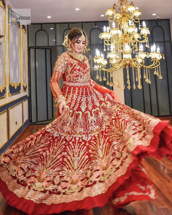 The deep orange colour is the perfect feminine and delicate shade with its meticulously crafted untruth. The stunning maxi is ornamented with tilla, dabka, kora, Kundan, Zardozi and crystals. Embroidery is done in the shade of gold.  The illusion neckline of the maxi just steals everyone's heart. Further, the full sleeves of the maxi are also decorated with geometric patterns. The frill of the following maxi gives a perfectly glamorous look to the whole reception wear. It is paired up with a dupatta which is adorned with floral motifs all over.