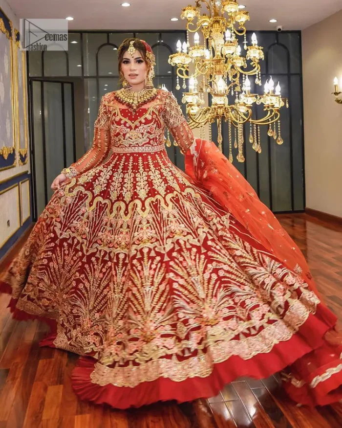The deep orange colour is the perfect feminine and delicate shade with its meticulously crafted untruth. The stunning maxi is ornamented with tilla, dabka, kora, Kundan, Zardozi and crystals. Embroidery is done in the shade of gold.  The illusion neckline of the maxi just steals everyone's heart. Further, the full sleeves of the maxi are also decorated with geometric patterns. The frill of the following maxi gives a perfectly glamorous look to the whole reception wear. It is paired up with a dupatta which is adorned with floral motifs all over.