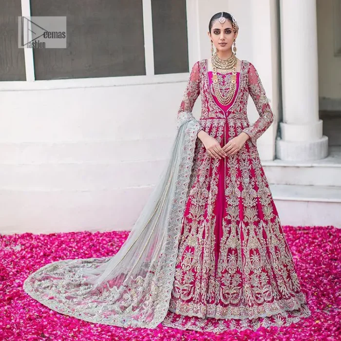 Be a dream vision in this floral shocking pink article. The shocking pink maxi is a breathtaking masterpiece that wins everyone's hearts at the very first glance. The stunning details of silver embroidery which includes tilla, dabka, kora, Kundan and zardozi give a royal touch to this scalloped maxi. The front open style and sweetheart neckline come together to make this outfit lovely and charming. The full sleeves give a glamorous touch to this perfectly maxi. It is paired with Lehenga to create a lavish look. The Lehenga has a huge flare and is also embellished with beautiful embroidery. Complete this walima article with a grey dupatta in a scalloped design which is adorned with a four-sided heavy embellishment. 