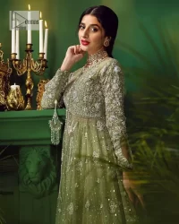 Experience the joy of a wedding in dreamy ensembles. Bringing old-world charm into your festive ensembles, it is a front open scalloped maxi intricately embellished with fine silver embroidery, crystals, tilla, dabka, kora and sequin. The full sleeves of the maxi make it an expression of timeless elegance. In addition to this, the V shape neckline makes this masterpiece unique and priceless. Paired with a long border embellished scalloped dupatta it all comes together to create a luxuriously chic look. The dupatta is also embellished with tiny floral motifs and sequins spray. Complete this party wear with a simple lehenga in the same colour to balance the overall look of the outfit.