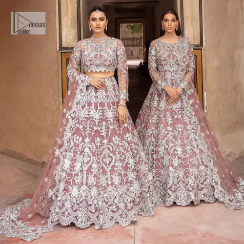 It’s regal, it’s rich, it’s festive. This magnificent nikah outfit is hand-embellished with luxury designs and beautiful silverwork which is