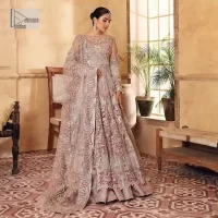 This elegantly poised ensemble defines nikah fashion in its most refined form! The scalloped maxi in premium quality is hand-embellished with beaming adornments and multiple colour embroidery. It is further enhanced with tilla, dabka, kora, Kundan and the real magic of crystals. Stunning designs on full sleeves and premium details on the illusion neckline make it an exquisite masterpiece. It is combined with sharara to balance the most demanding and delicate look. Finish this nikah wear with a dupatta in the same colour. The borders of this dupatta are heavily embellished, giving a perfectly glamorous look to the beautiful attire.