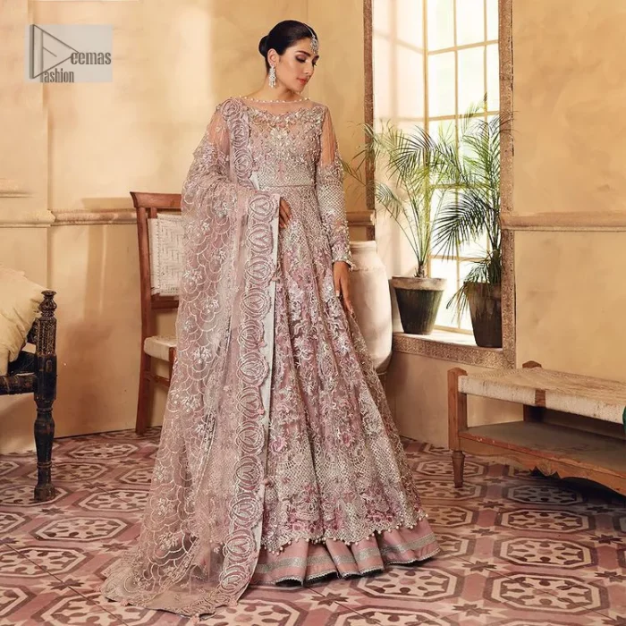 This elegantly poised ensemble defines nikah fashion in its most refined form! The scalloped maxi in premium quality is hand-embellished with beaming adornments and multiple colour embroidery. It is further enhanced with tilla, dabka, kora, Kundan and the real magic of crystals. Stunning designs on full sleeves and premium details on the illusion neckline make it an exquisite masterpiece. It is combined with sharara to balance the most demanding and delicate look. Finish this nikah wear with a dupatta in the same colour. The borders of this dupatta are heavily embellished, giving a perfectly glamorous look to the beautiful attire.