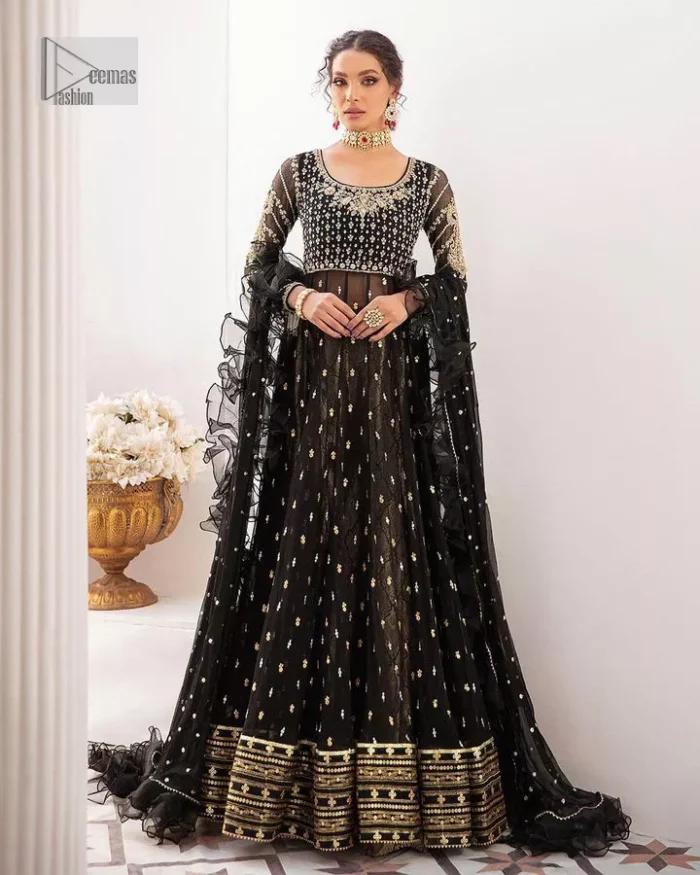 Let your outfit speak for the style tale itself! The frock, lehenga and dupatta combination is a breathtaking attire that comes in black colour. Traditional designs and hand-crafted embellishments on the frock which involves tilla, dabka, kora and Zardozi give a magnificent look to this perfectly. The beautiful light golden embroidery on full sleeves makes this article stunning and loving. It is paired with jamawar lehenga in the same colour to add some traditional look. Complete this party wear with a frilled dupatta sparkling with a sequin spray to make your day bright. 