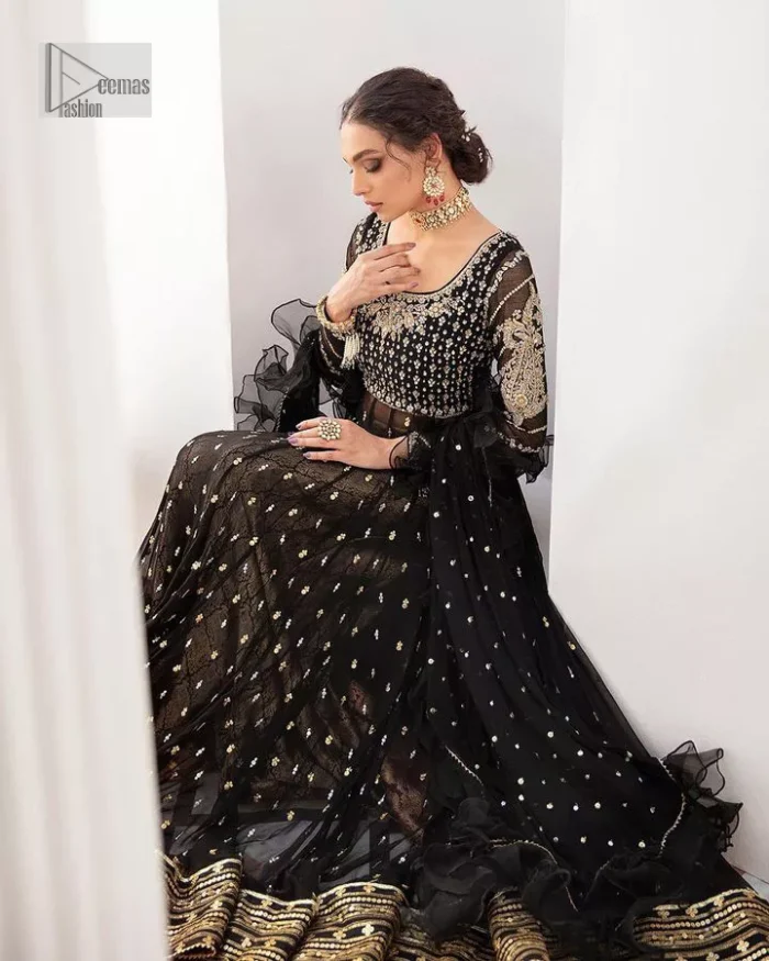 Let your outfit speak for the style tale itself! The frock, lehenga and dupatta combination is a breathtaking attire that comes in black colour. Traditional designs and hand-crafted embellishments on the frock which involves tilla, dabka, kora and Zardozi give a magnificent look to this perfectly. The beautiful light golden embroidery on full sleeves makes this article stunning and loving. It is paired with jamawar lehenga in the same colour to add some traditional look. Complete this party wear with a frilled dupatta sparkling with a sequin spray to make your day bright. 