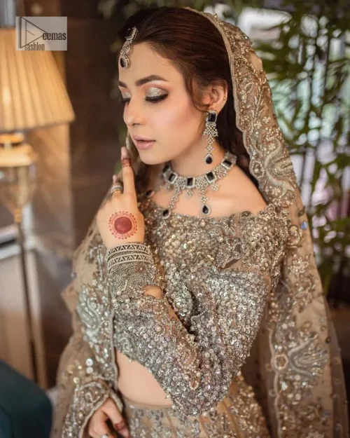 A dreamy statement of brown nikah outfit! This dress proffers a brown hue with its glamorous silver embroidery. The handsome