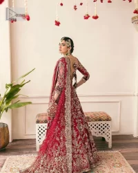 The beauty of this ensemble is mirrored in the romantic colour palette! The blouse is in a dark red shade and is fully decorated with intricate designs and fine details of goldwork. Lavish embroidery, tilla,dabka, kora, Kundan, gold, and zari work make this reception outfit a charismatic masterpiece. The boat shape neckline on a scalloped blouse gives the gorgeous Bride a head-turning look. In addition to this, the three-quarter sleeves for a more upscale appearance and feel. It is systemized with a lehenga in the same colour adorned with heavy floral patterns that are essential for your dreamy look. Complete this romantic look with a dupatta framed with four-sided embellished borders and sequins sprayed all over. Still, thinking? This is a no-brainer. Get your hands on this one ASAP before it sells out!